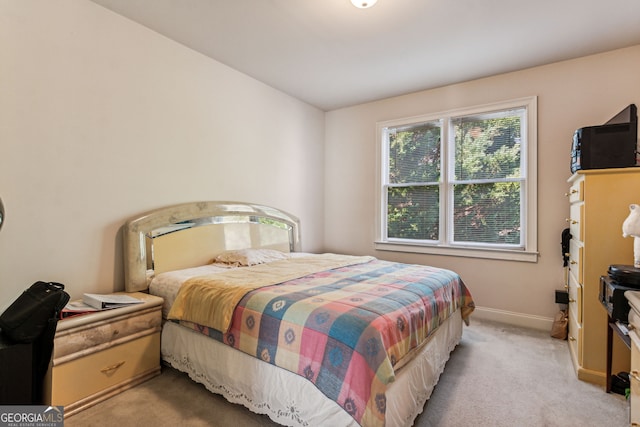 bedroom featuring light colored carpet