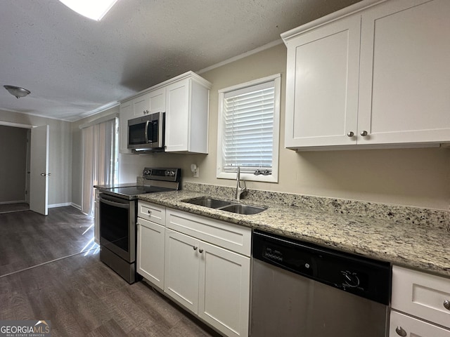 kitchen featuring white cabinets, dark hardwood / wood-style flooring, sink, and appliances with stainless steel finishes