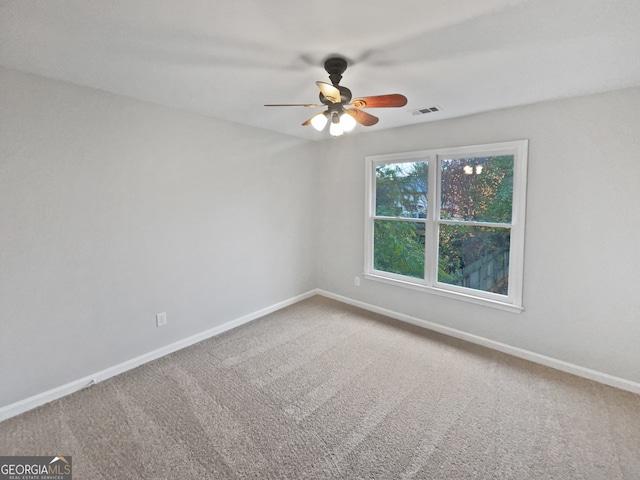 carpeted empty room with ceiling fan