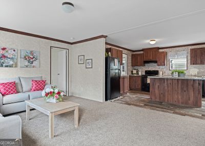 living room featuring light colored carpet and crown molding