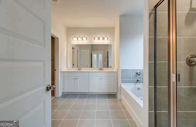 bathroom featuring tile patterned floors, vanity, and independent shower and bath