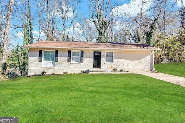 ranch-style house featuring a front yard and a garage