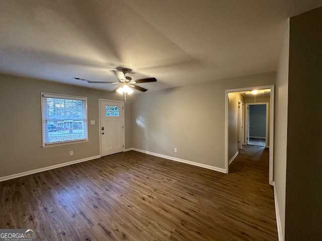 interior space with dark hardwood / wood-style flooring and ceiling fan