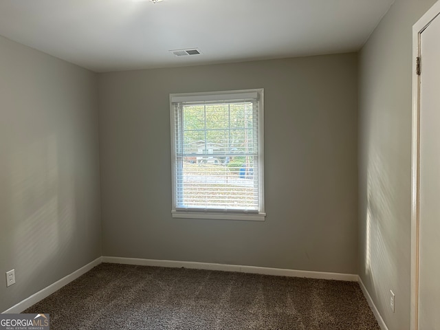 unfurnished room with carpet flooring