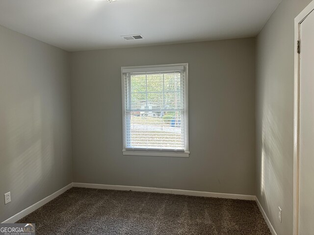 2190 Westover Dr, East Point, GA 30344 - unfurnished room with dark colored carpet and baseboards