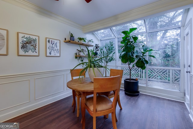 dining space featuring ornamental molding, lofted ceiling, ceiling fan, and dark wood-type flooring