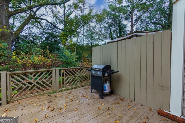 wooden terrace with grilling area