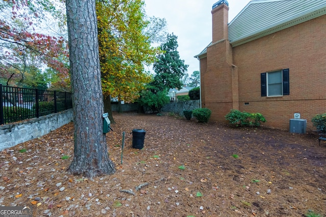 view of yard with central AC