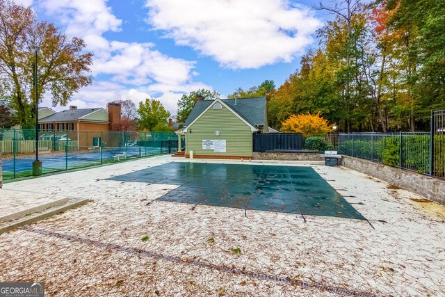 view of swimming pool featuring a patio area