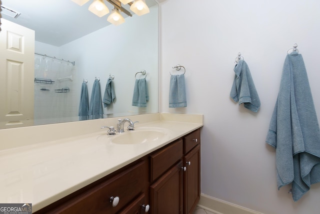 bathroom featuring vanity and walk in shower