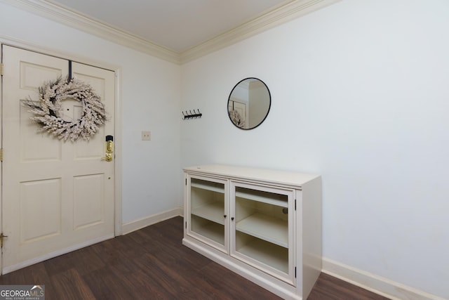 foyer entrance featuring dark hardwood / wood-style flooring and crown molding