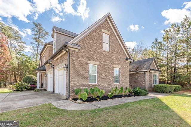 view of home's exterior featuring a lawn and a garage