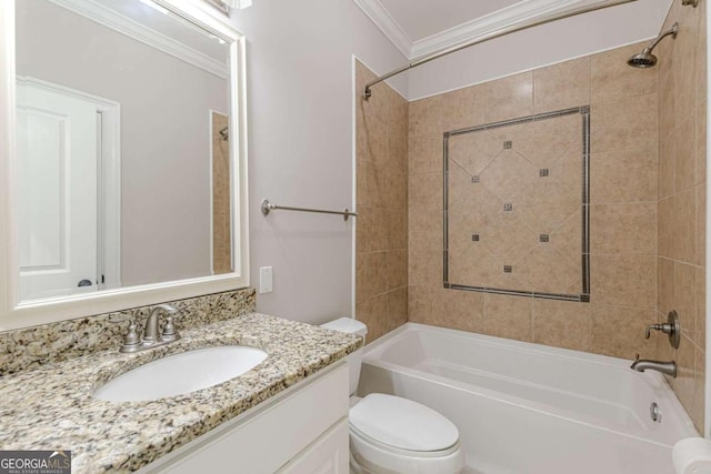 full bathroom with vanity, toilet, tiled shower / bath, and ornamental molding