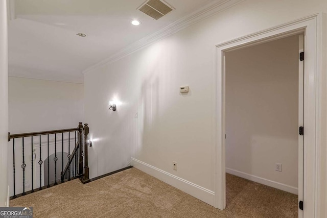 hall featuring crown molding and carpet floors