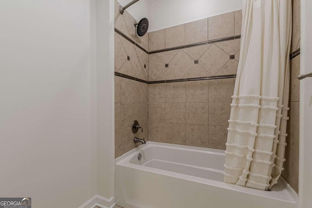 bathroom featuring shower / tub combo with curtain