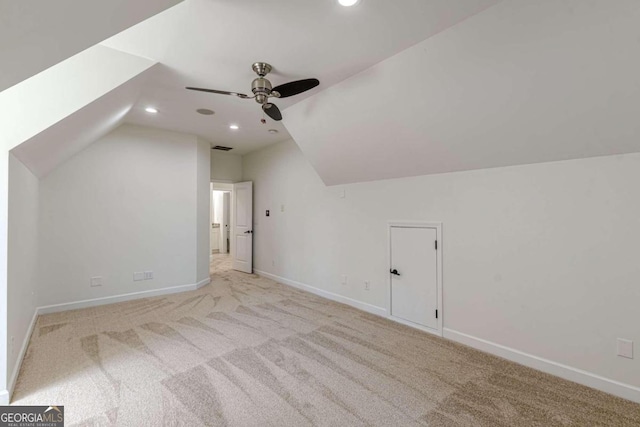 bonus room with light carpet, ceiling fan, and lofted ceiling