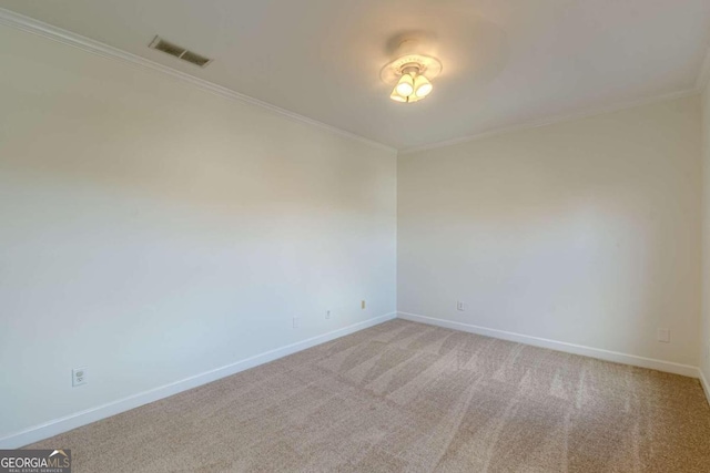 carpeted spare room with crown molding