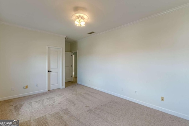 spare room with light carpet and ornamental molding