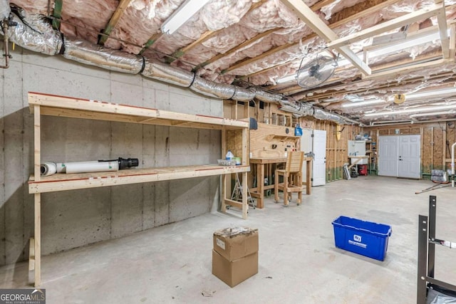 basement with a workshop area