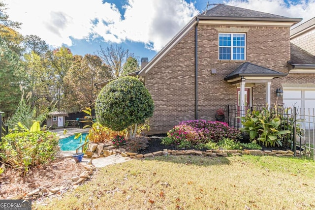 view of property exterior featuring a yard and a garage