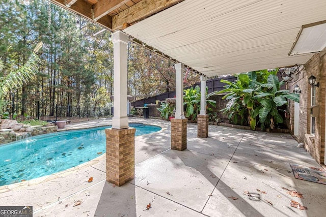 view of patio / terrace featuring a fenced in pool