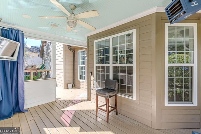 exterior space with ceiling fan