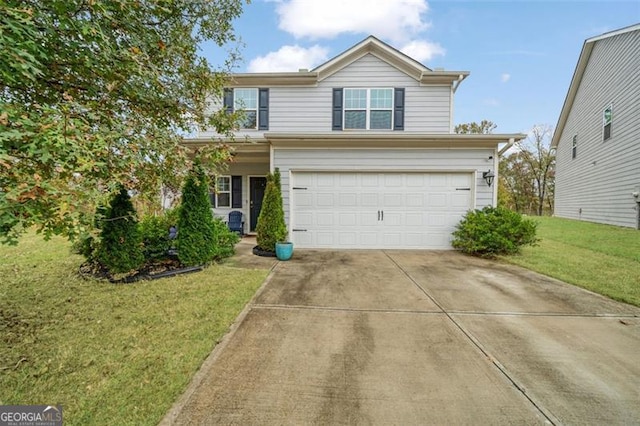 view of front property featuring a garage and a front lawn