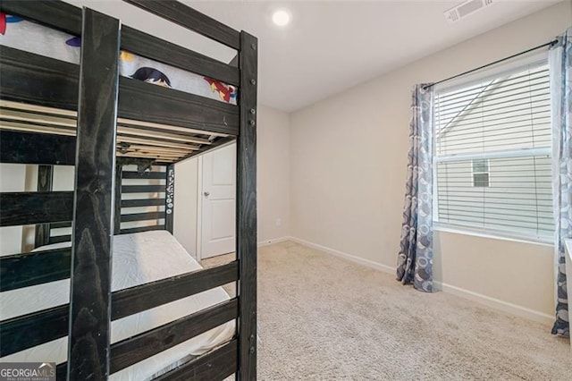 bedroom with light colored carpet