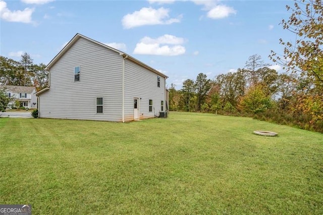 view of side of home featuring a lawn