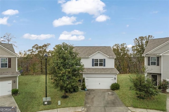 view of front facade featuring a front yard and a garage