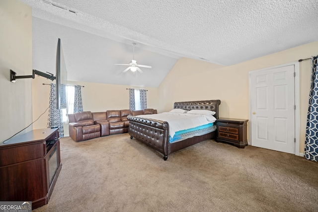 bedroom featuring a textured ceiling, ceiling fan, light carpet, and lofted ceiling