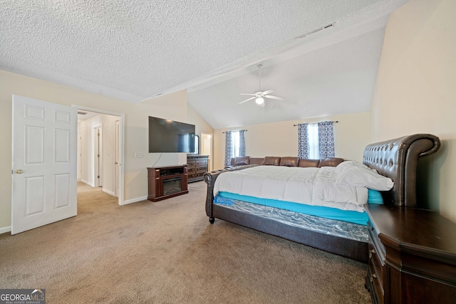 carpeted bedroom featuring a textured ceiling, ceiling fan, and lofted ceiling