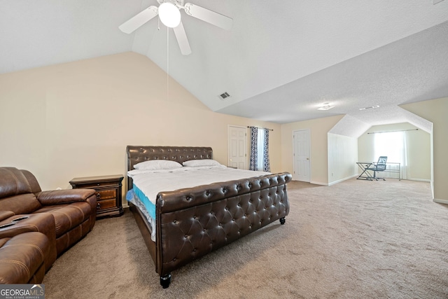 carpeted bedroom with a textured ceiling, ceiling fan, and lofted ceiling