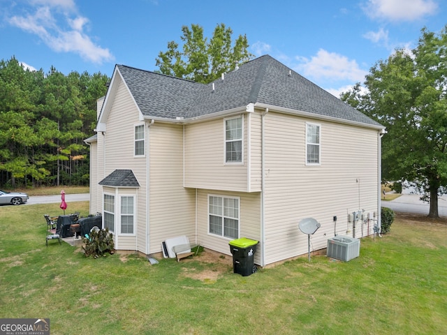 view of home's exterior with cooling unit, a yard, and a patio