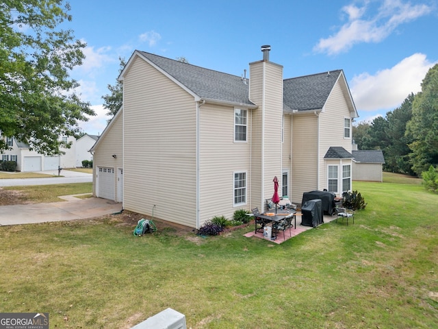 rear view of house featuring a yard and a patio