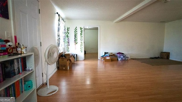 interior space featuring hardwood / wood-style floors and a textured ceiling