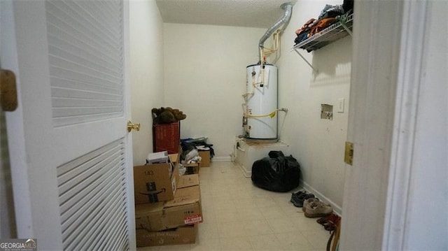 laundry area with water heater