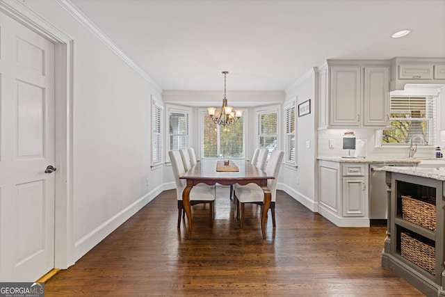 dining space featuring dark hardwood / wood-style floors, a healthy amount of sunlight, and crown molding