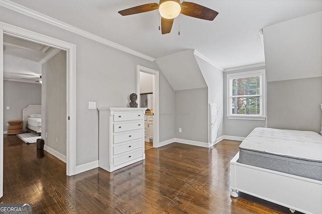 bedroom with dark wood-type flooring, ensuite bathroom, vaulted ceiling, ceiling fan, and ornamental molding