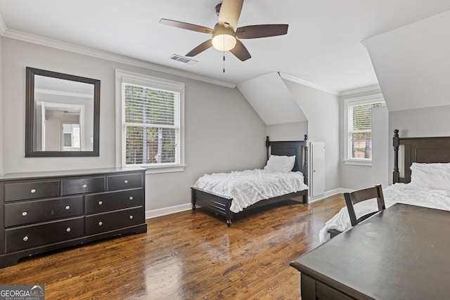 bedroom with dark hardwood / wood-style floors, ceiling fan, and ornamental molding