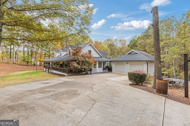 view of front of property with a garage and covered porch