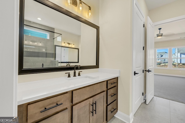 bathroom with tile patterned flooring, vanity, and a shower with shower door