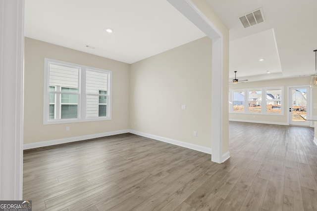 empty room featuring ceiling fan and light wood-type flooring