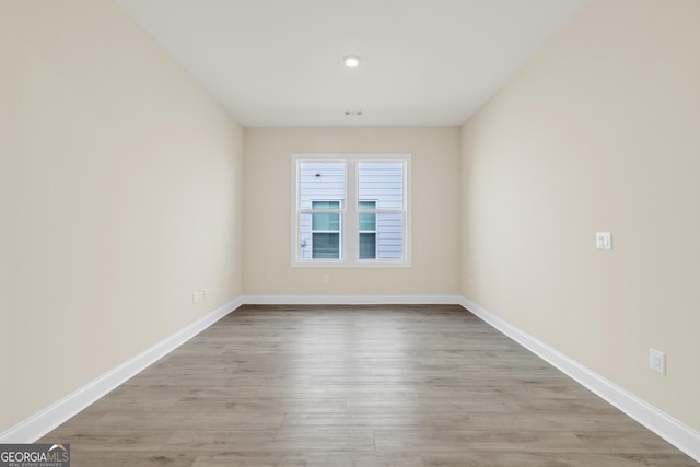 empty room with light hardwood / wood-style floors