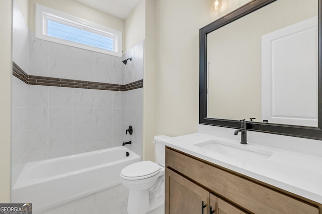 full bathroom featuring toilet, vanity, and tiled shower / bath combo