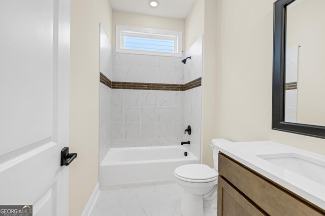 full bathroom featuring vanity, toilet, and tiled shower / bath