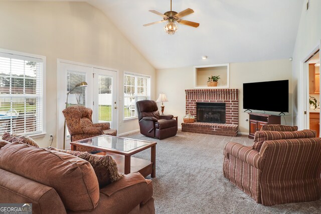 living room with light carpet, plenty of natural light, ceiling fan, and high vaulted ceiling