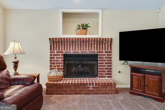 carpeted living room featuring a brick fireplace