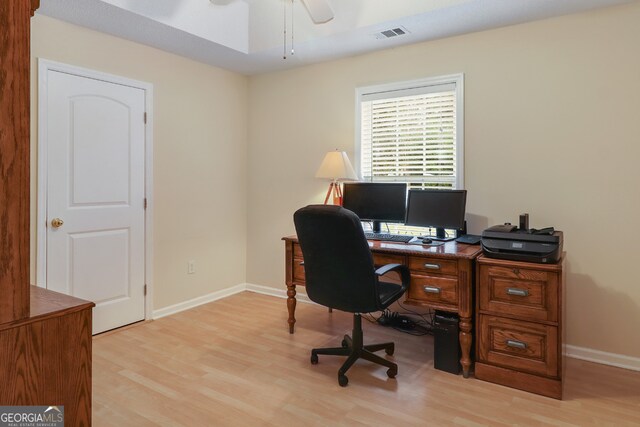 office area featuring light hardwood / wood-style flooring and ceiling fan