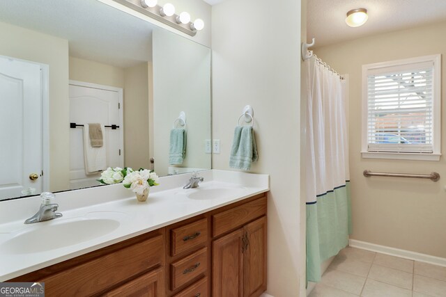 bathroom featuring tile patterned flooring and vanity